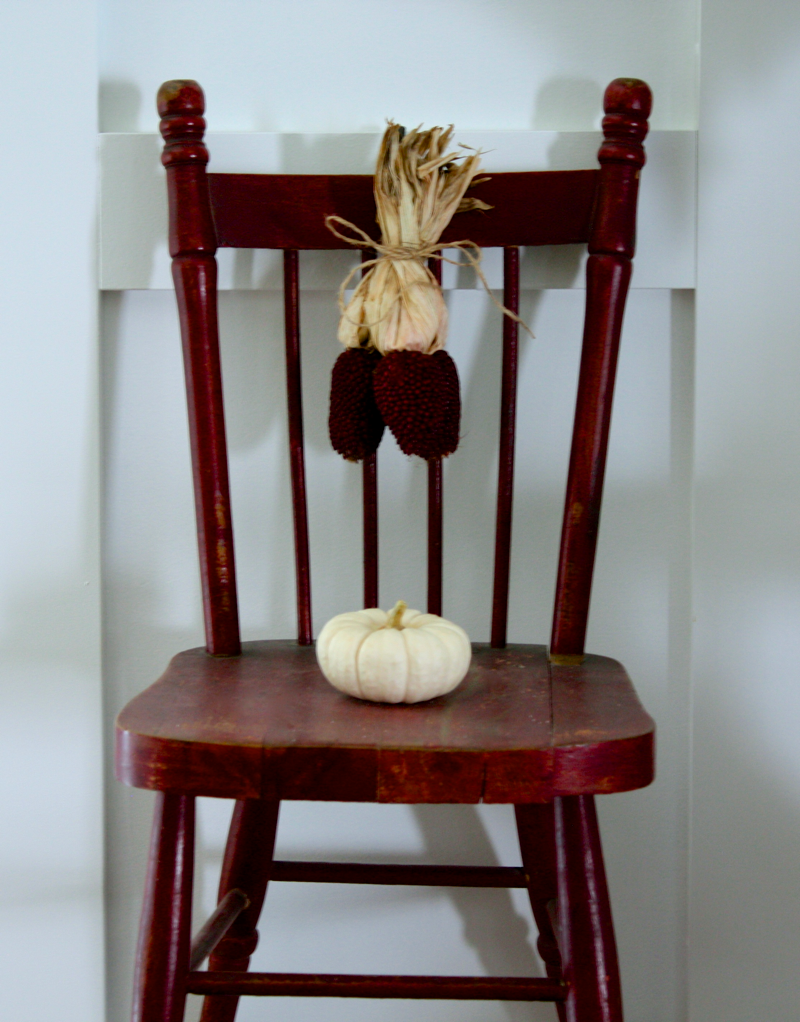 Little chair hanging on the wall… cynthiaweber.com