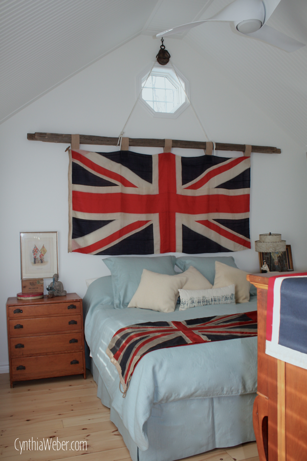 Rustic Bedroom Ideas… Union Jack Flag hung by an antique pulley on a cedar rail… CynthiaWeber.com