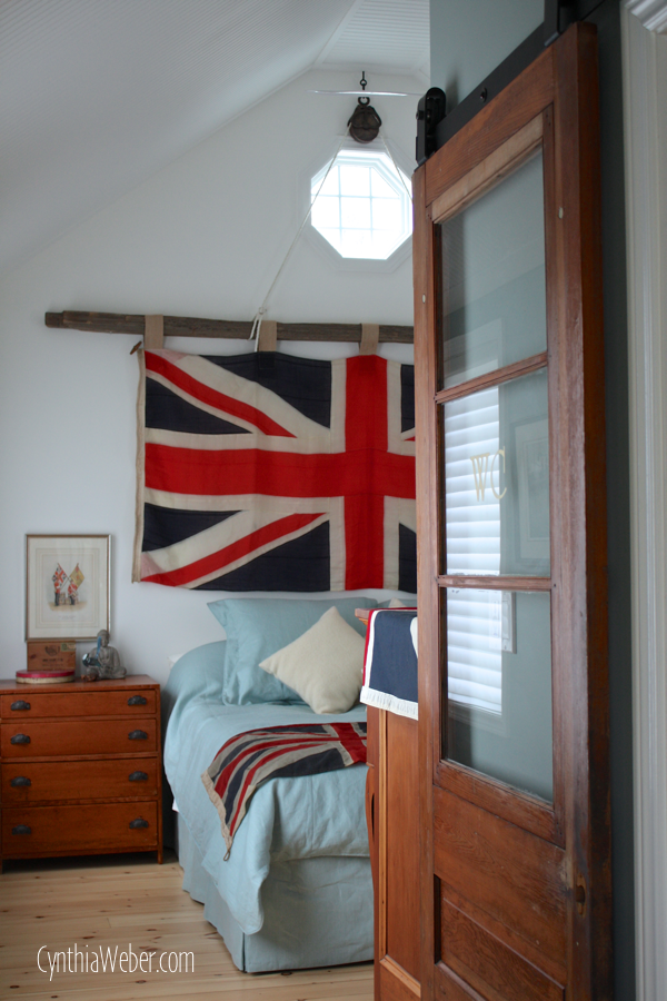 Rustic Bedroom reveal featuring a Union Jack Flag mounted on an Antique Pulley and cedar rail… CynthiaWeber.com