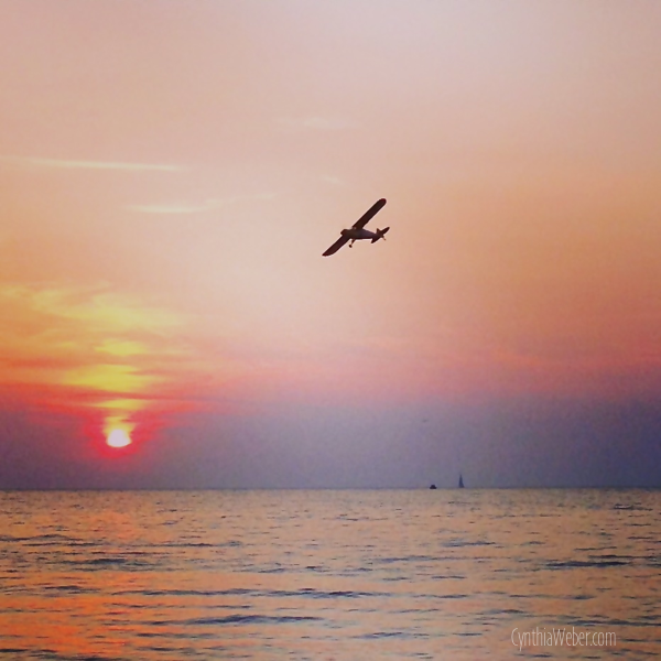 Plane over Sunset on Bayfield Beach… CynthiaWeber.com