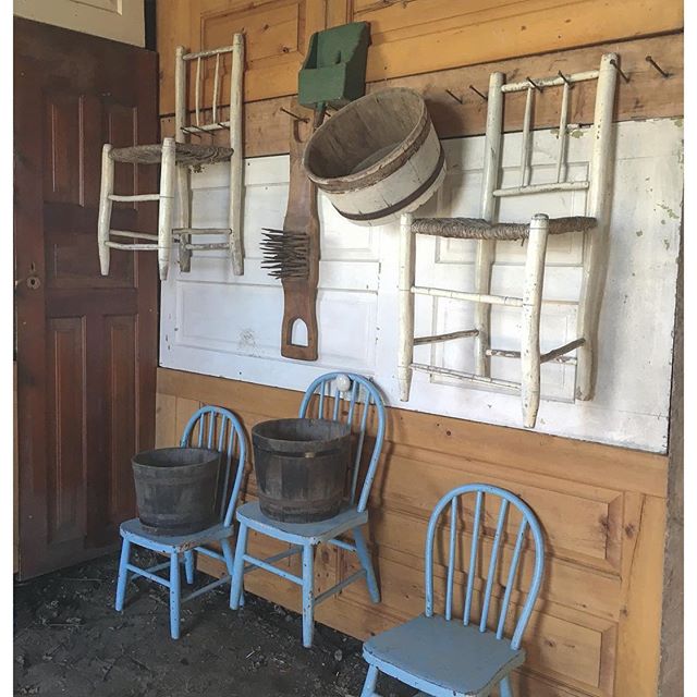 old doors and antique children sized chairs hung in the horse barn at BannockBurn 1878...